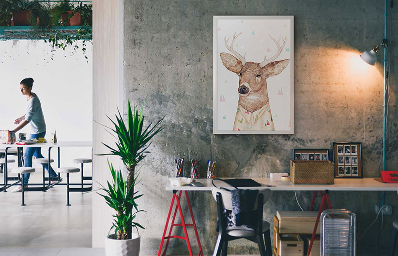 Picture frame mockup on a wall in an office